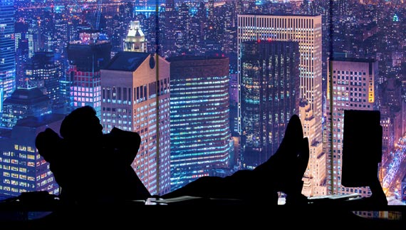 Photo
                                                          above of a man
                                                          looking out of
                                                          a skyscraper
                                                          window at the
                                                          night city
                                                          skyline, (c)
                                                          by Elnur at
                                                          Bigstock.com